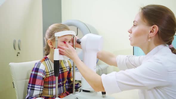 Ophthalmologist Examines the Girl on a Corneo Topographer