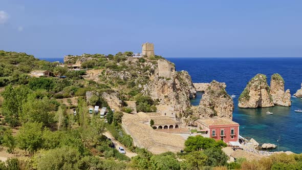 Unique panoramic view of Stacks or Faraglioni of Scopello with Tonnara or tunnery and Torre Doria wa