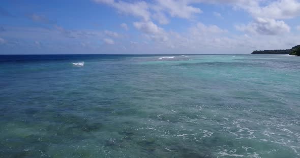 Natural drone abstract view of a white paradise beach and blue sea background in colourful 4K