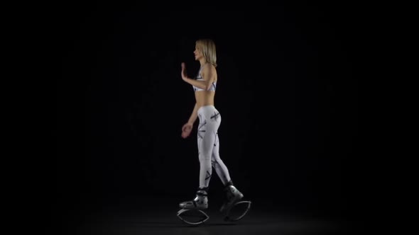 Slow Motion, Fitness Instructor Performing Exercises in Kangoo Jumps Shoes.