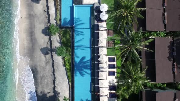 Aerial pool view and white sand beaches with coconut tree, summer holiday concept 