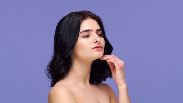 Studio portrait of young and beautiful brunette woman.