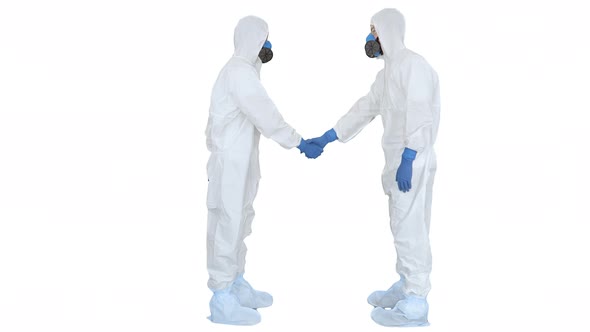 Doctors or Scientists in Hazamat Suits Meet and Shake Hands on White Background