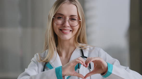 Caucasian Doctor Specialist Nurse Woman Practitioner Therapist in Glasses in Clinic Hospital at