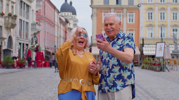 Senior Old Stylish Tourists Looking Smartphone Sincerely Rejoicing Win Message with Good News