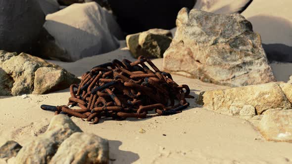 Old Rusted Chain in the Sand