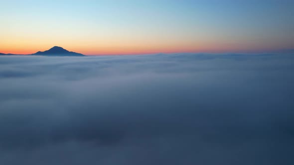 4K Drone Flying in the clouds. Flying through the clouds during sunrise