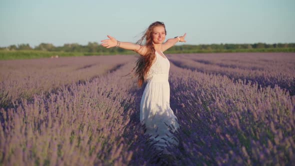 Young Girl Among Blooming Lavender Fields