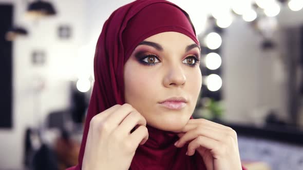 Gorgeous Caucasian Looking Girl at Her 20's Puts on Purple Chiffon Hijab or Traditional Arabic Head