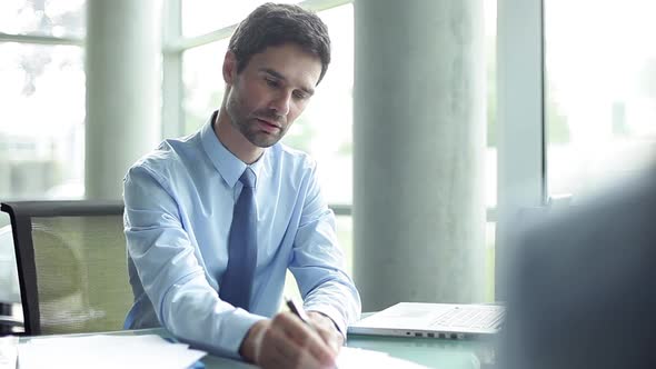 Businessman consulting client in office