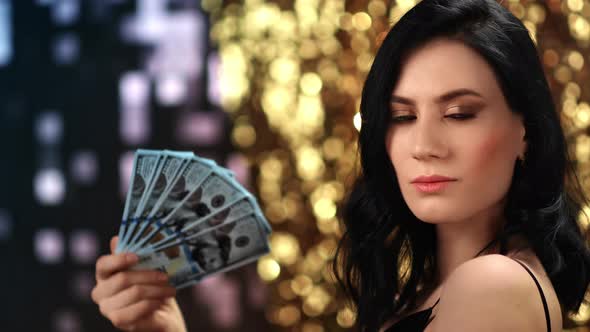 Gorgeous Lady Waving Cash Dollar Money Fan at Illuminated Disco