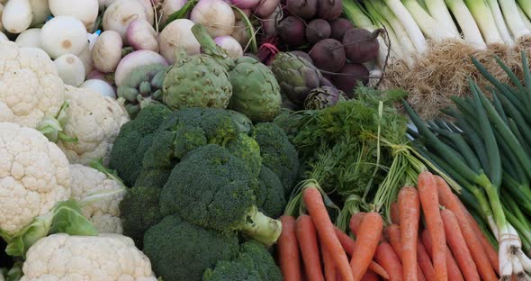 Fresh vegetables on stalls in a southern France market.