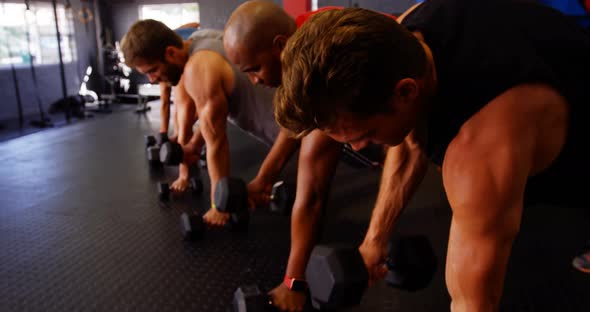 Group of people exercising with dumbbell