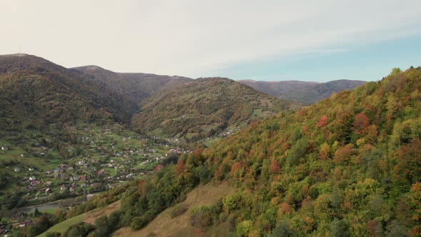 Aerial Autumn Forest at Mountain Range
