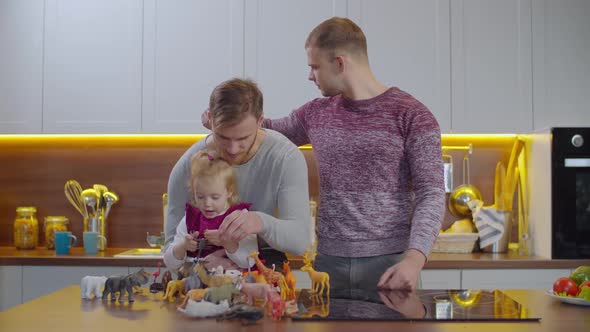 Adopted Child Playing Animal Figures at Home