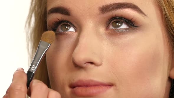 Beauty Girl with Makeup Brush, Close Up, Slow Motion