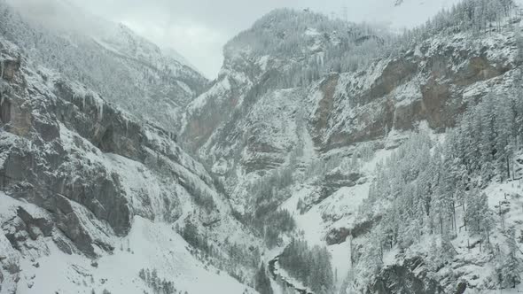 Aerial of beautiful snow covered valley with a river