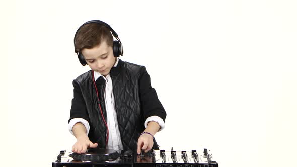 Cool Boy Dj in Headphones Playing on Vinyl. White Background