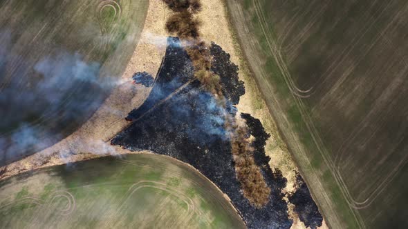 Aerial Top View of Wild Fire in Bartinney Nature Reserve in west Cornwall, South Africa.