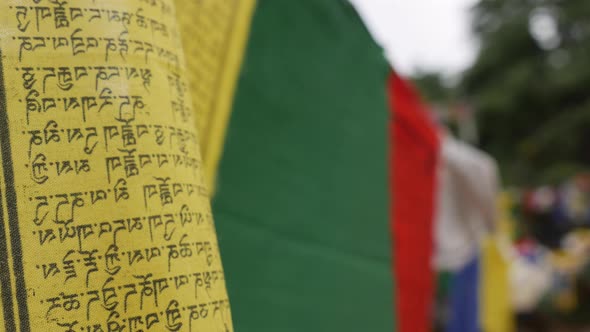 Closeup of Colorful Buddhist Tibetan Prayer Flags at Mountains Wave in the Breeze Blowing