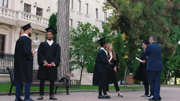 Multiethnic Students After Graduation Meeting in alt