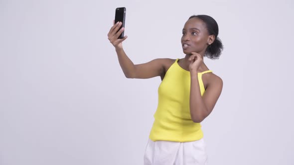 Young Happy African Woman Video Calling with Phone