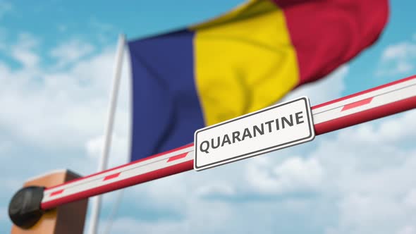 Open Boom Gate with QUARANTINE Sign Near the Romanian Flag alt