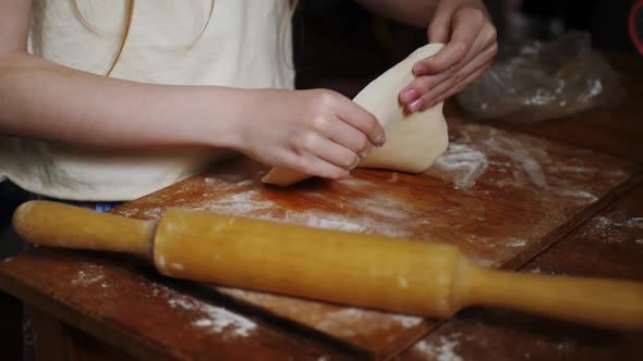 Closeup Child Makes Homemade Flatbread From Wheat Flour with Gluten Slowmotion