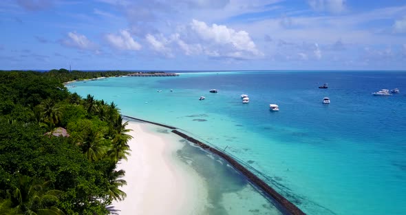 Natural flying copy space shot of a sandy white paradise beach and aqua blue ocean background in hig