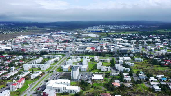 Panoramic Aerial View Over The City Of Reyjavik On A Cloudy Morning. - Aerial Drone Shot