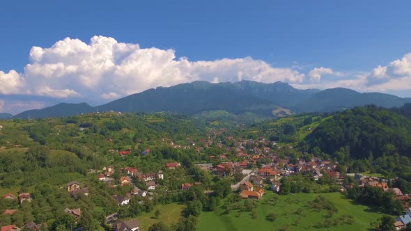 Aerial View above Small Village in Mountains