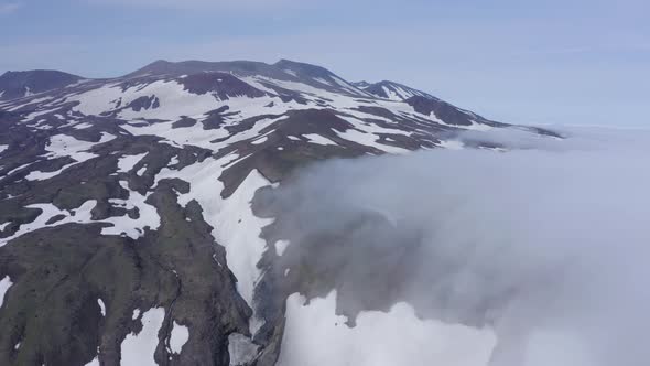 Aerial Footage of the Gorely Volcano Peaks Rising Above the Fog