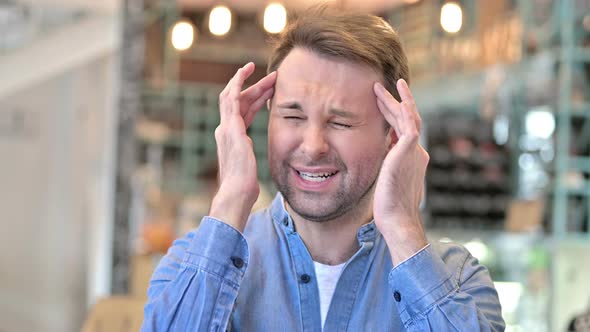 Portrait of Stressed Casual Man Having Headache