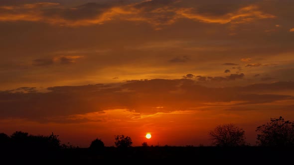 Clouds dramatic at sunset rural farm meadow horizon view