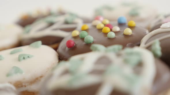 Panning over cookies with sprinkles close-up 4K 2160p 30fps UltraHD footage - Colorful teacakes stuf