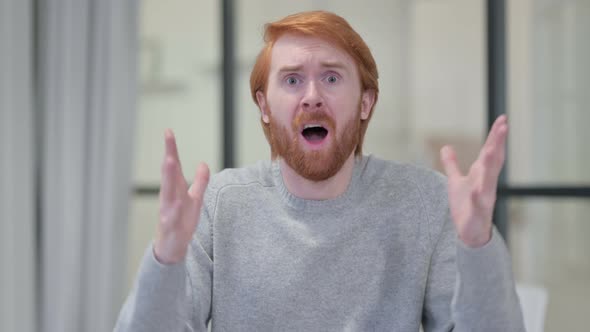 Portrait of Young Redhead Man Having Loss