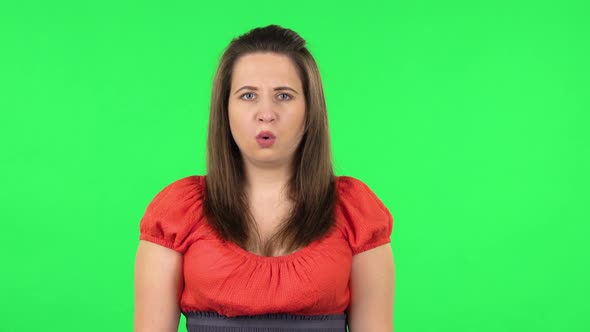 Portrait of Frustrated Girl Says Wow with Shocked Facial Expression. Green Screen