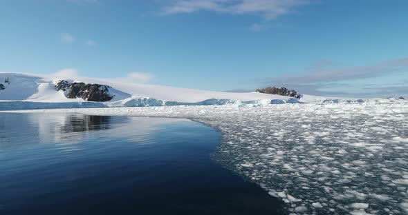 Ice floes and snow covered coast