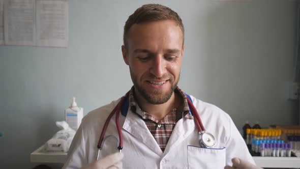 Portrait of Smiling Doctor Putting on Mask to Get to Work During Corona Virus Pandemic