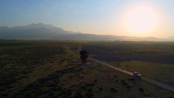 Aerial View Car Driving At Sunrise