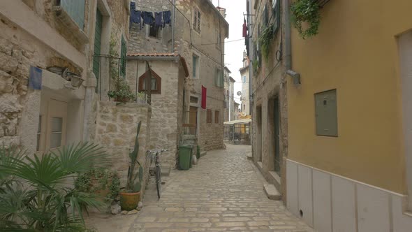 Stone wall buildings on a paved street