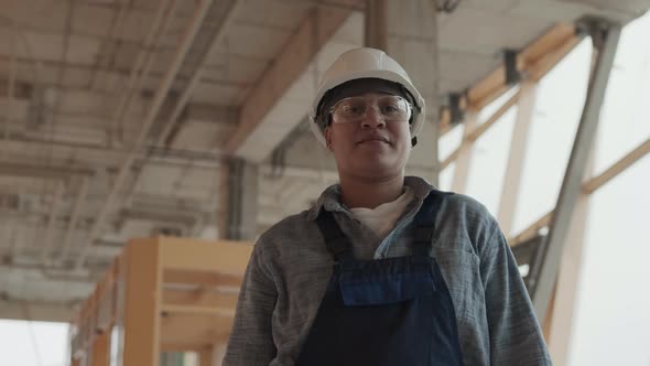 Builder Posing in House under Construction