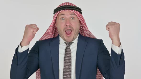 Excited Arab Businessman Celebrating Success, White Background