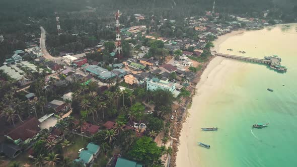 Aerial Slow Flight Over the Island Beach Dramatic Sky