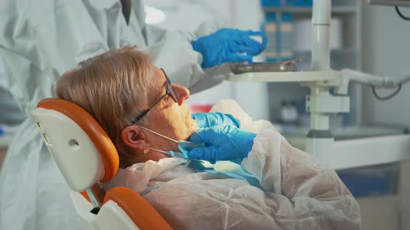 Dentist Technician in Coverall Drilling Woman Tooth