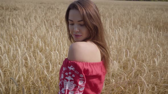 Portrait Charming Young Woman Enjoying Nature and Sunlight in Wheat Field at Incredible Colorful Sun