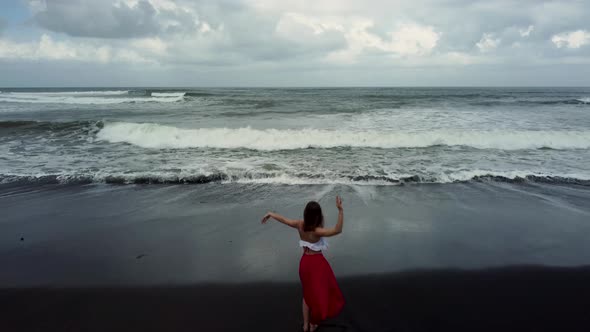 Young Woman Dance in Front of Ocean