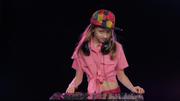 Teenager Girl in Bright Cap Playing on the Dj Keyboard