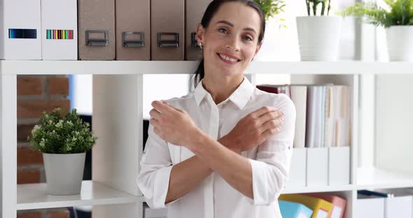 Young Smiling Businesswoman Folds Arms on Chest While Standing in Office Slow Motion  Movie