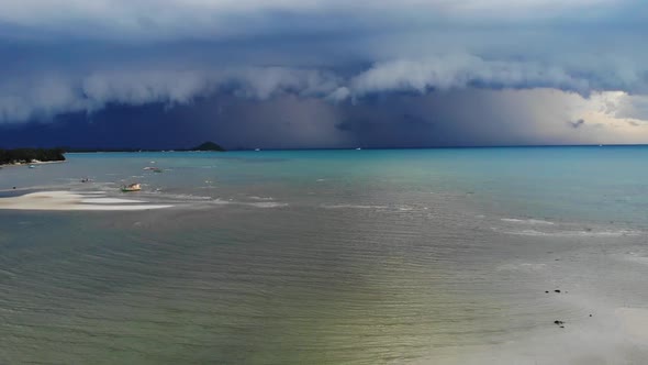 Thick Clouds Over Waving Sea. Thick Blue Clouds Floating on Sky Over Waving Sea During Wet Season